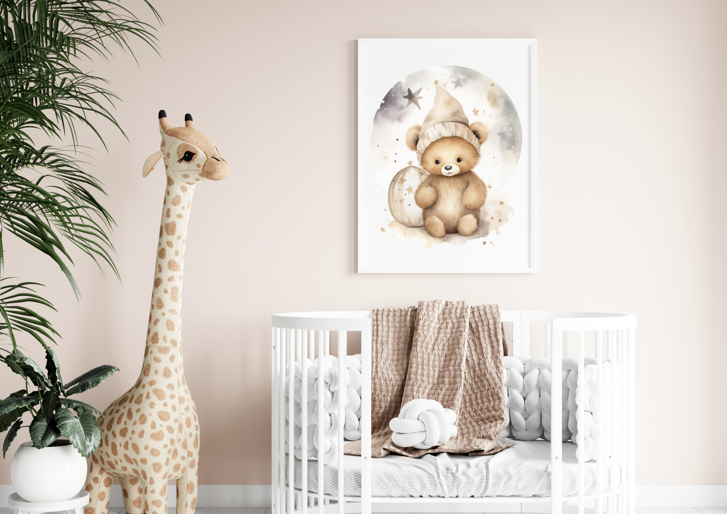 Poster with teddy bear design in a baby's room, featuring a crib and giraffe plush décor.