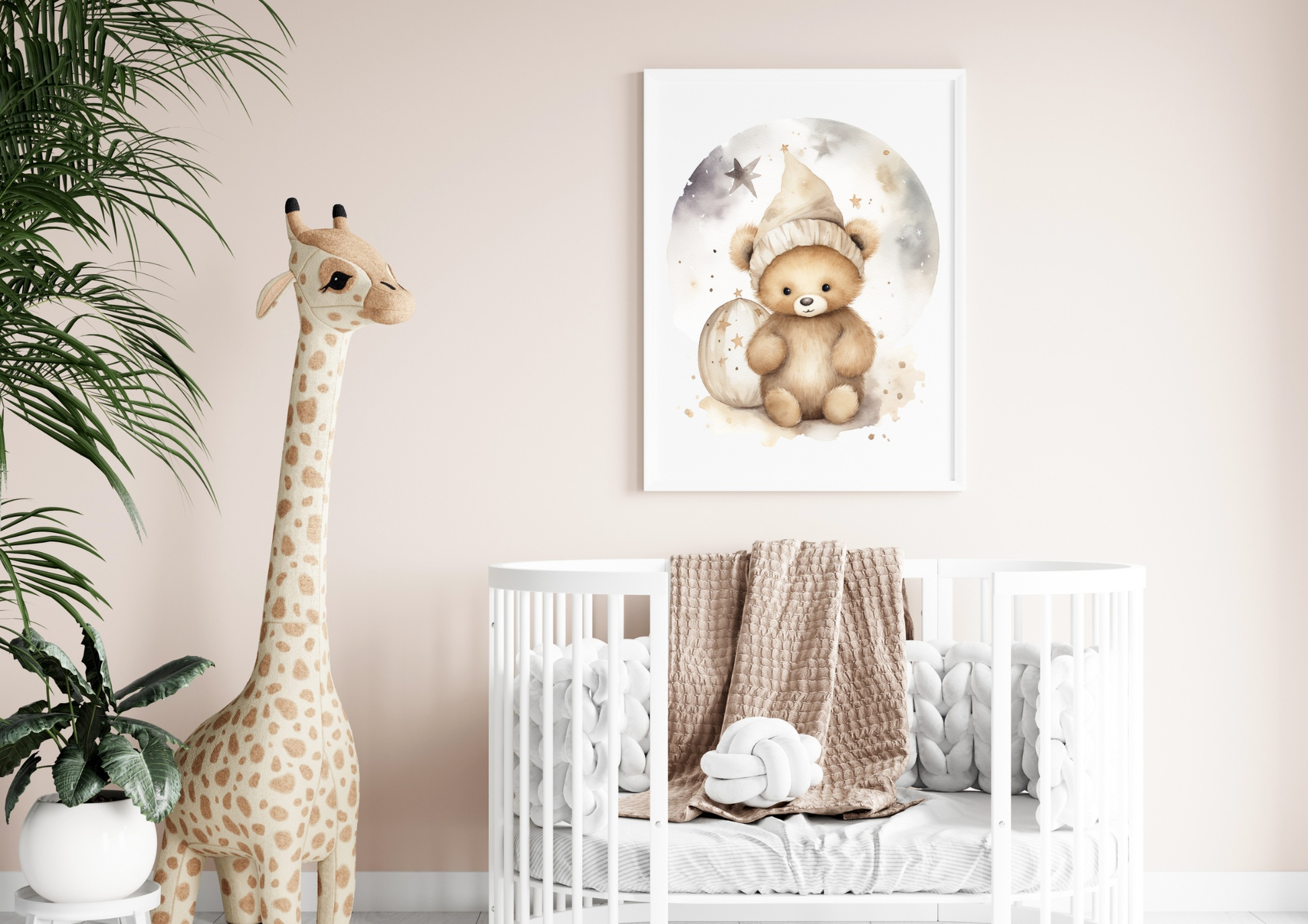 Poster with teddy bear design in a baby's room, featuring a crib and giraffe plush décor.