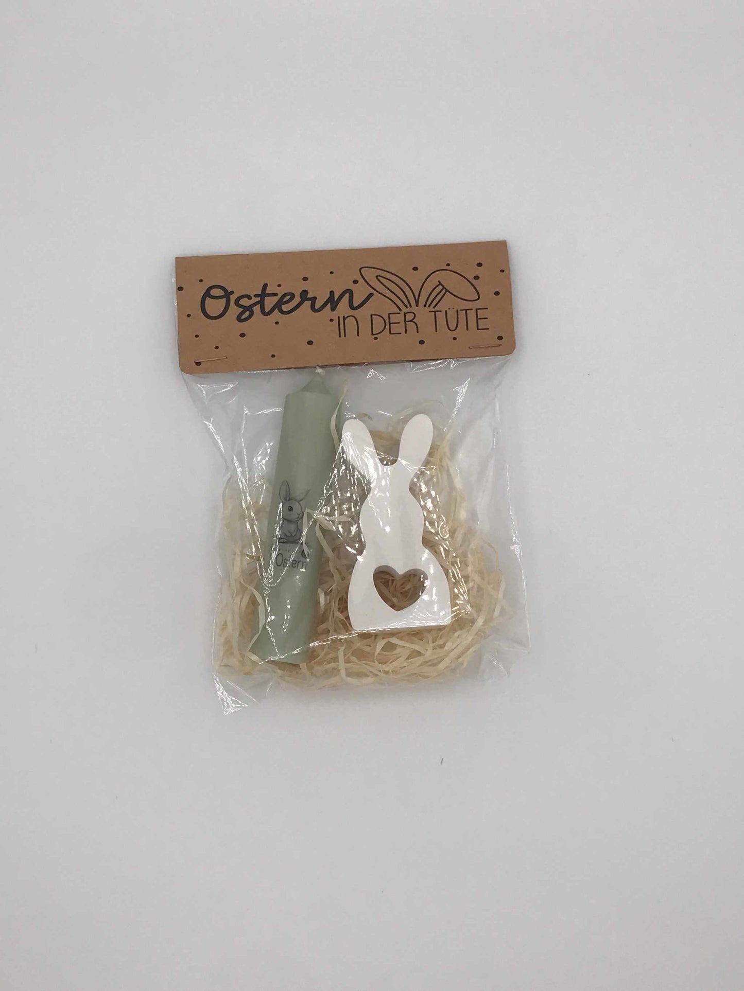 Ostergeschenkset mit Kerze und keramischem Hasen in Geschenkverpackung.