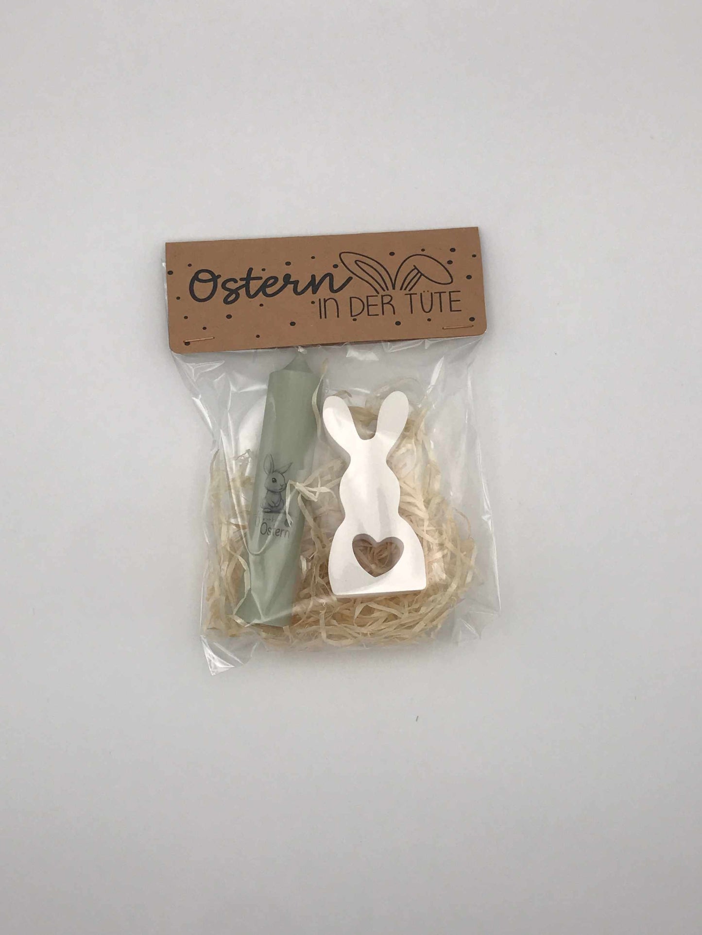 Ostergeschenk-Set mit Kerze und handgefertigtem Keramikhase in Geschenkbox.