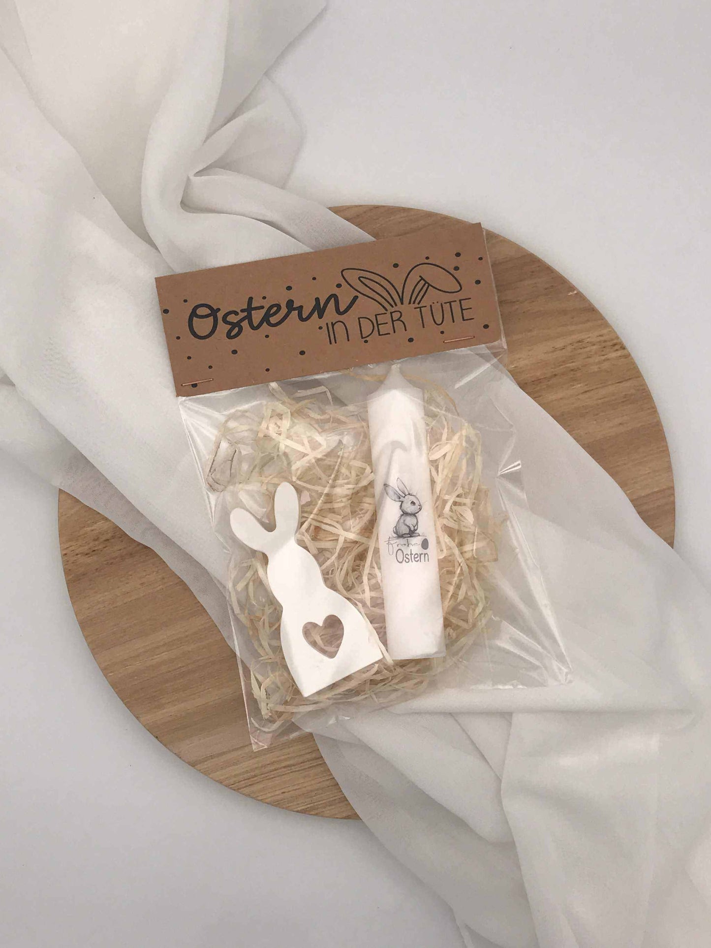 Easter gift set with decorative bunny and candle in a gift box.