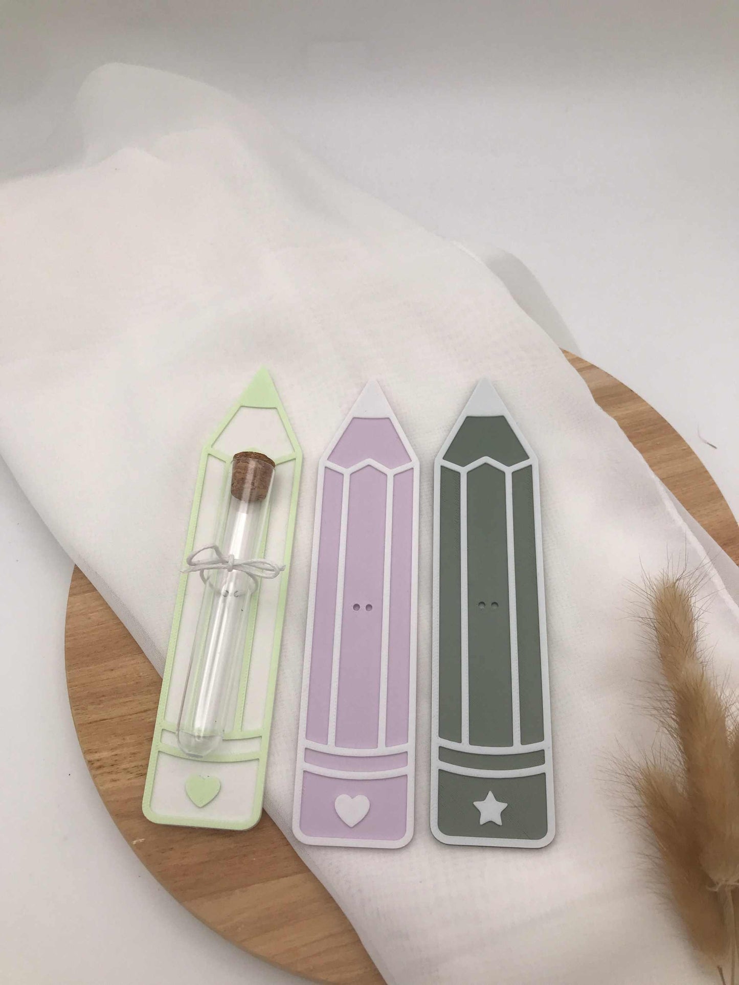 3D-printed pencil-shaped money gift for school enrollment with test tube holder in pastel green, purple, and gray colors
