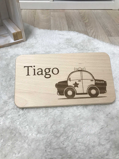 Wooden breakfast board with engraved police car design and the name "Tiago".