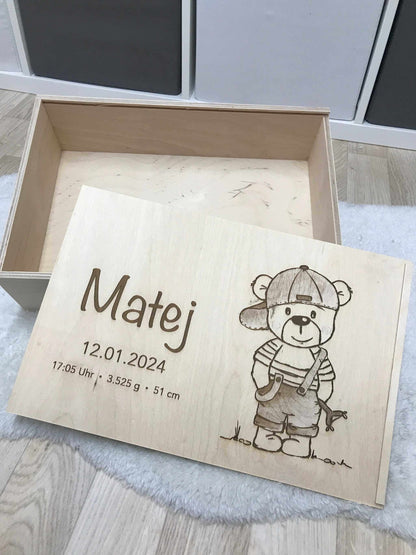 Wooden memory box featuring engraved birth details and bear illustration.
