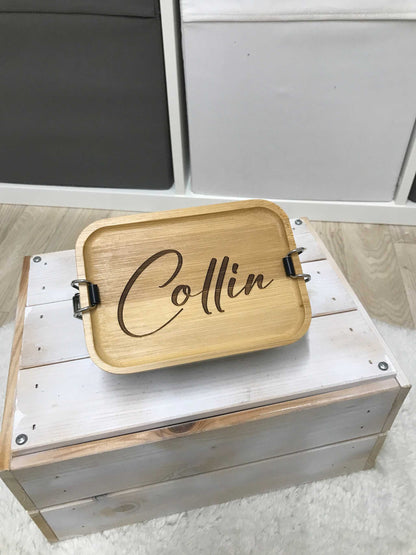 Personalized bamboo lunchbox with engraved name, handcrafted with high-quality material for freshness and style.