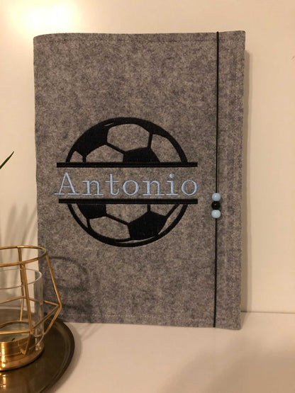 Felt document folder for school certificates with soccer design and personalized name "Antonio".
