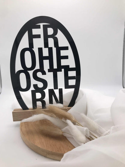 Osterdekoration "Frohe Ostern" Schriftzug aus Acryl und Holzklötzchen.