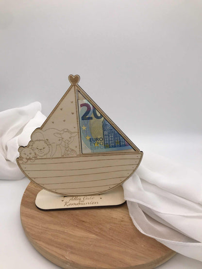 Creative wooden money gift for baptism, communion, or confirmation, featuring a heart-topped boat design.