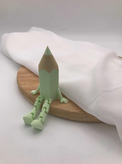 3D-gedruckter grüner Deko-Stift mit beweglichen Wackelbeinen als Einschulungsgeschenk und Tischdekoration