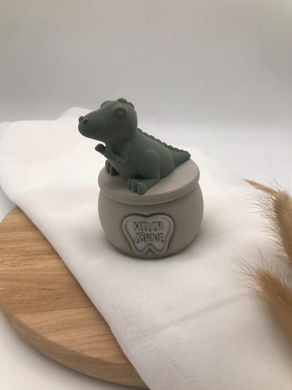 3D-gedruckte Milchzahndose aus PLA mit kleinem Dino auf dem Deckel zur Aufbewahrung erster Zähne für Kinder