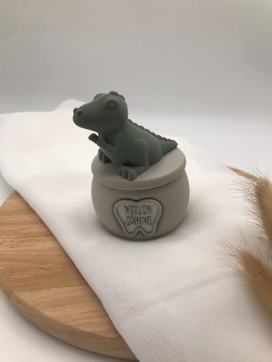 3D-gedruckte Milchzahndose aus PLA mit kleinem Dino auf dem Deckel zur Aufbewahrung erster Zähne für Kinder